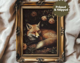 May include: A framed print of a red fox lying in a bed of flowers. The fox is looking to the right, and its fur is a rich, reddish-brown color. The flowers are a variety of colors, including pink, white, and yellow.