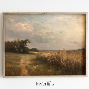 May include: A vintage oil painting depicting a rural landscape with a dirt path leading through a field of tall grass. The sky is a soft blue with fluffy white clouds. The painting is framed in a simple, light wood frame.