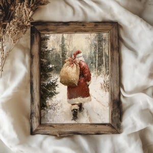 May include: A vintage-style painting of Santa Claus walking through a snowy forest, carrying a large sack of gifts. The painting is framed in a rustic wooden frame.