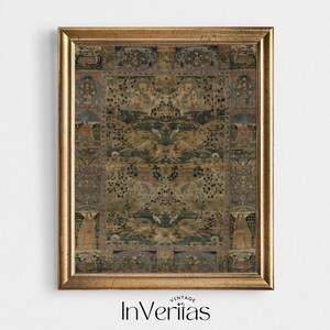 May include: A framed vintage print with an intricate design in green, brown, and blue hues. The artwork displays symmetrical patterns, figures, and landscape details. The frame is gold-coloured, and the print is labelled "InVeriias" at the bottom.