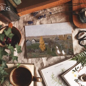 May include: A vintage-style print of a painting depicting a rural landscape with a few houses and a lone yellow tree in the foreground. Three white figures are walking along a path in the distance. The print is surrounded by books, plants, and other decorative items.