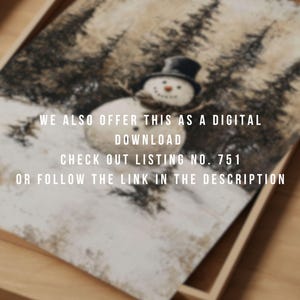 May include: A watercolor painting of a snowman in a black top hat standing in a snowy forest. The painting has a rustic, vintage feel. The text "WE ALSO OFFER THIS AS A DIGITAL DOWNLOAD CHECK OUT LISTING NO. 751 OR FOLLOW THE LINK IN THE DESCRIPTION" is printed at the bottom of the painting.