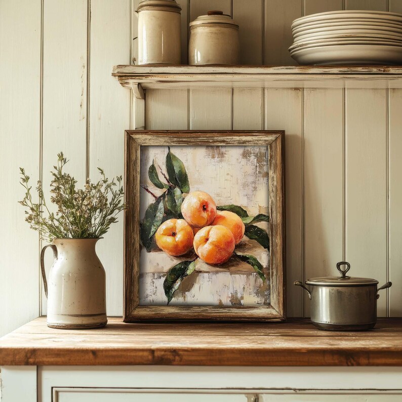 May include: A framed painting of a still life featuring four ripe peaches with green leaves on a white background.