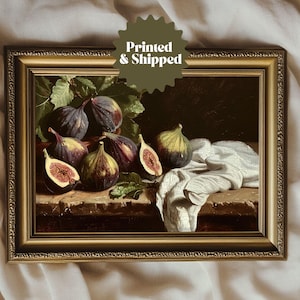 May include: A framed painting depicting a still life of ripe figs in a bowl, with a white cloth draped over the table. The painting has a dark background and warm, inviting colours.