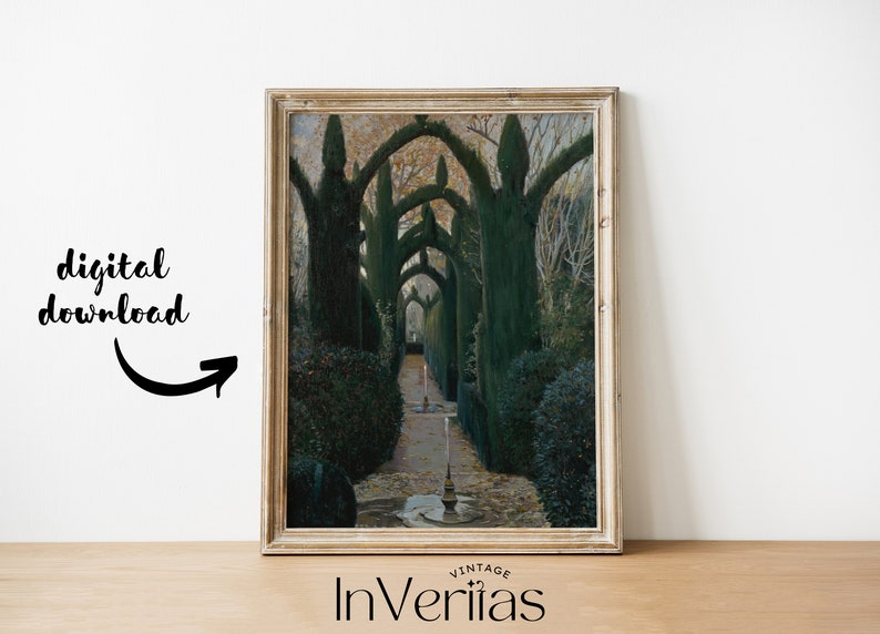 May include: A framed print of a vintage photograph showing a pathway lined with trees that have been pruned into arches. The trees are green and the pathway is lined with stones. The image is in a light wood frame.