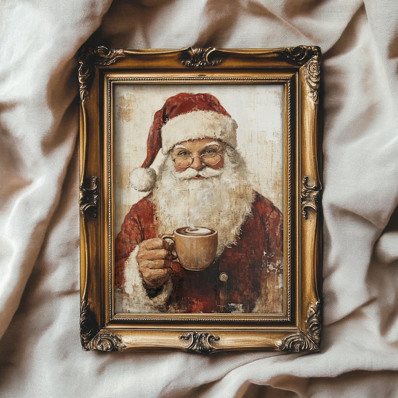 May include: A framed painting of Santa Claus wearing a red hat and a white beard, holding a mug of hot chocolate. The frame is gold with ornate details.