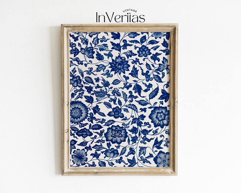 May include: A framed print featuring a blue and white floral pattern. The print has a repeating design of stylised flowers and leaves.