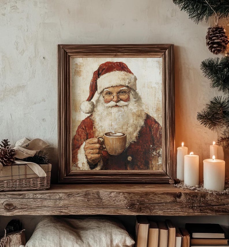 May include: A framed painting of Father Christmas wearing a red suit and a white beard, holding a mug of hot chocolate. The painting has a rustic, vintage style.