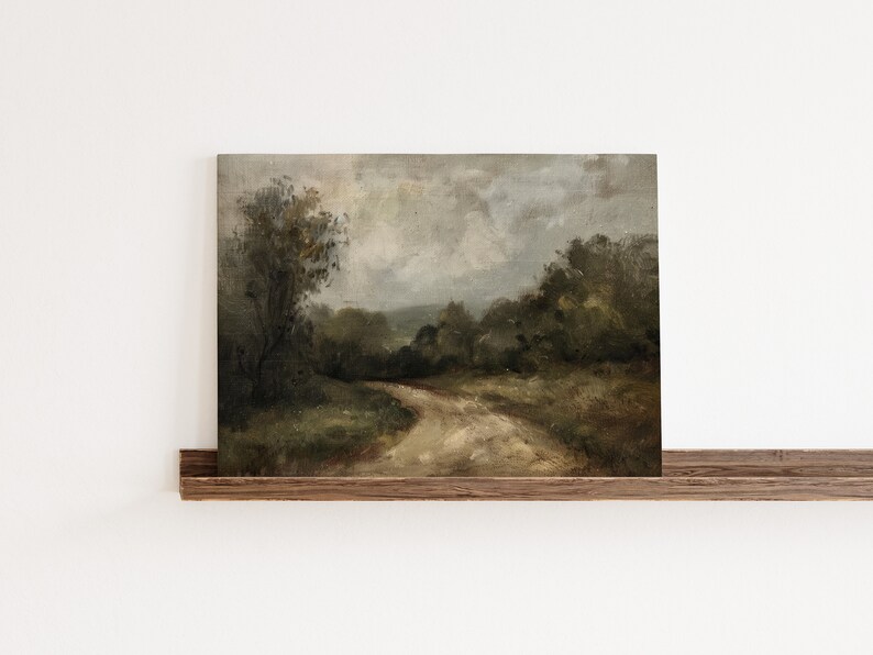 May include: A vintage oil painting depicting a winding dirt road through a lush green forest. The sky is overcast with gray clouds, creating a moody atmosphere.