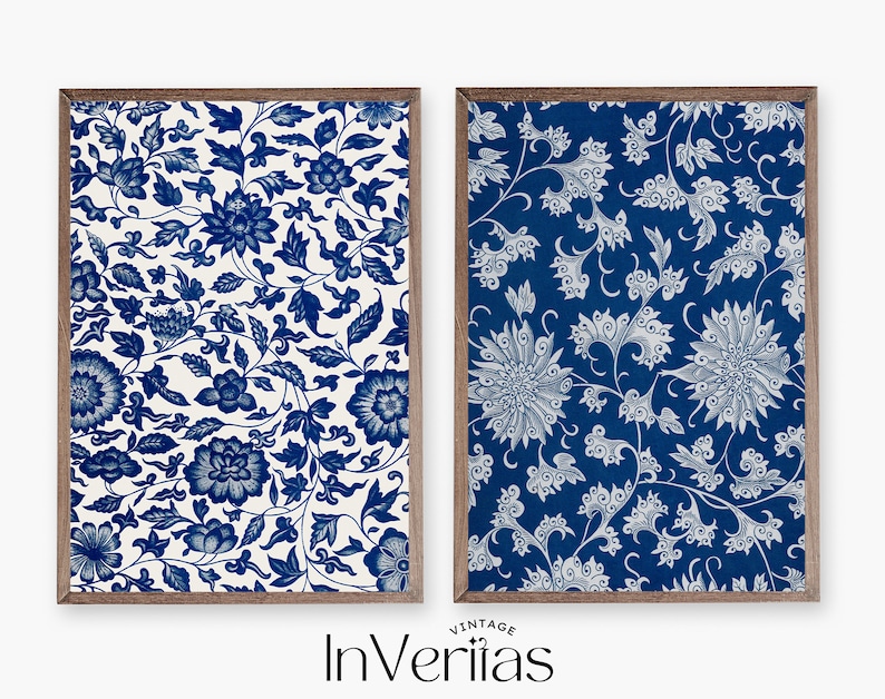 May include: Two framed prints featuring blue and white floral patterns. The print on the left has a white background with blue flowers. The print on the right has a blue background with white flowers.