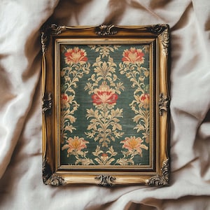 May include: A gold-colored ornate frame with a green background and a floral pattern in red, yellow, and gold. The floral pattern is symmetrical and features a repeating design.