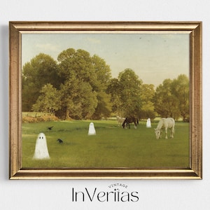 May include: A framed vintage print featuring a pastoral scene with horses grazing in a green field. Several cartoon ghosts are scattered across the landscape. The print is in a gold-colored frame. The text "InVeriitas" is at the bottom.