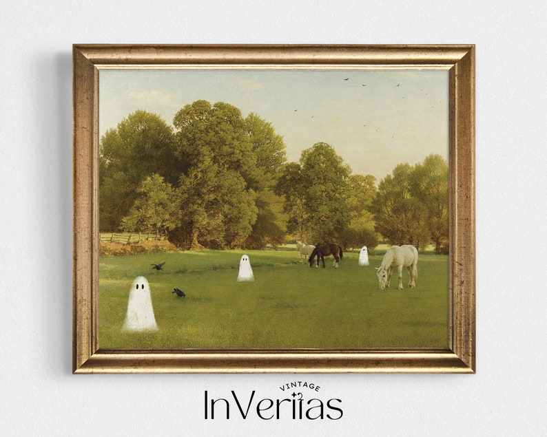 May include: A framed vintage print featuring a pastoral scene with horses grazing in a green field. Several cartoon ghosts are scattered across the landscape. The print is in a gold-colored frame. The text "InVeriitas" is at the bottom.