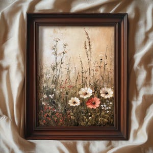 Peut inclure: Une peinture encadrée représentant un champ de fleurs sauvages avec des fleurs blanches et roses. La peinture a un aspect vintage et rustique.