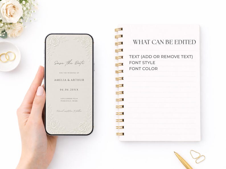 Puede incluir: Un tel&eacute;fono inteligente que muestra una invitaci&oacute;n de boda digital beige con esquinas florales en relieve, con el texto Save the Date, AMELIA & ARTHUR, 06.06.20XX y detalles de ubicaci&oacute;n, junto a un cuaderno de espiral con texto editable.