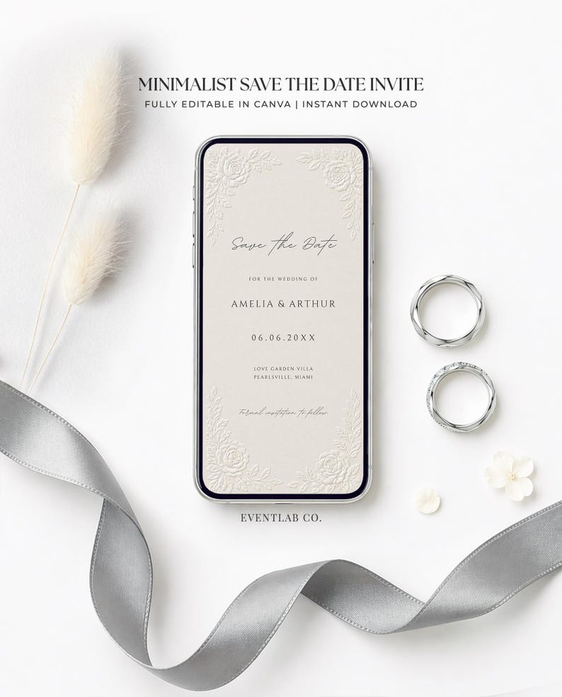 Puede incluir: Un tel&eacute;fono inteligente que muestra una invitaci&oacute;n digital de reserva de fecha con bordes florales y el texto Save the Date, Amelia & Arthur, 06.06.20XX, Love Garden Villa, Pearlsville, Miami. Dos anillos plateados y una cinta gris est&aacute;n cerca.