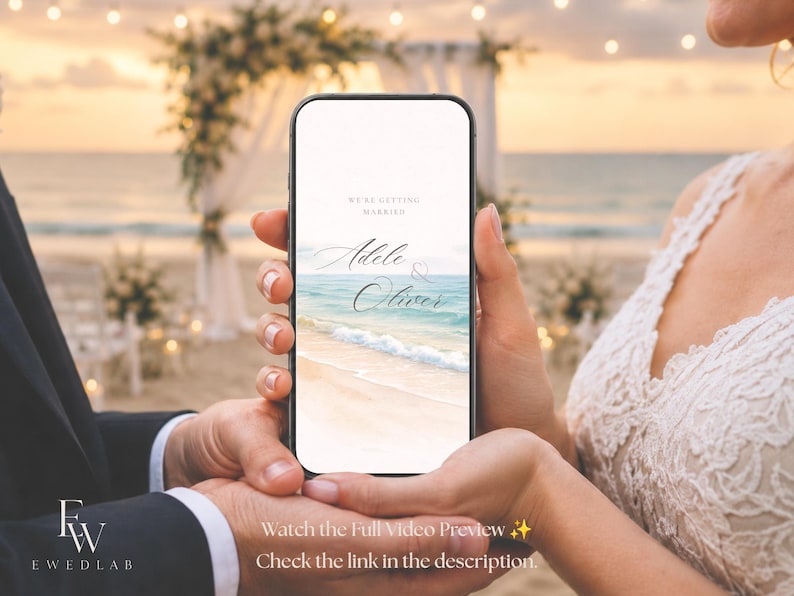 May include: A smartphone displaying a digital wedding invitation with the text WE'RE GETTING MARRIED and the names Adele & Oliver. The screen features a graphic of a sandy beach with turquoise ocean waves under a soft sunset sky.
