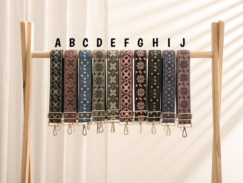 May include: Nine different patterned straps with gold hardware. The straps are labeled A through J.