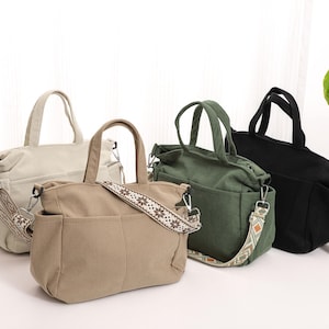 May include: Four tote bags in different colours, including beige, green, and black. The bags have a corduroy texture and feature a decorative strap with a geometric pattern.