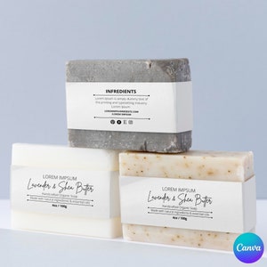 May include: Two bars of handmade organic soap, one gray and one white with speckles, labeled "Lavender & Shea Butter" and "4oz / 100g".