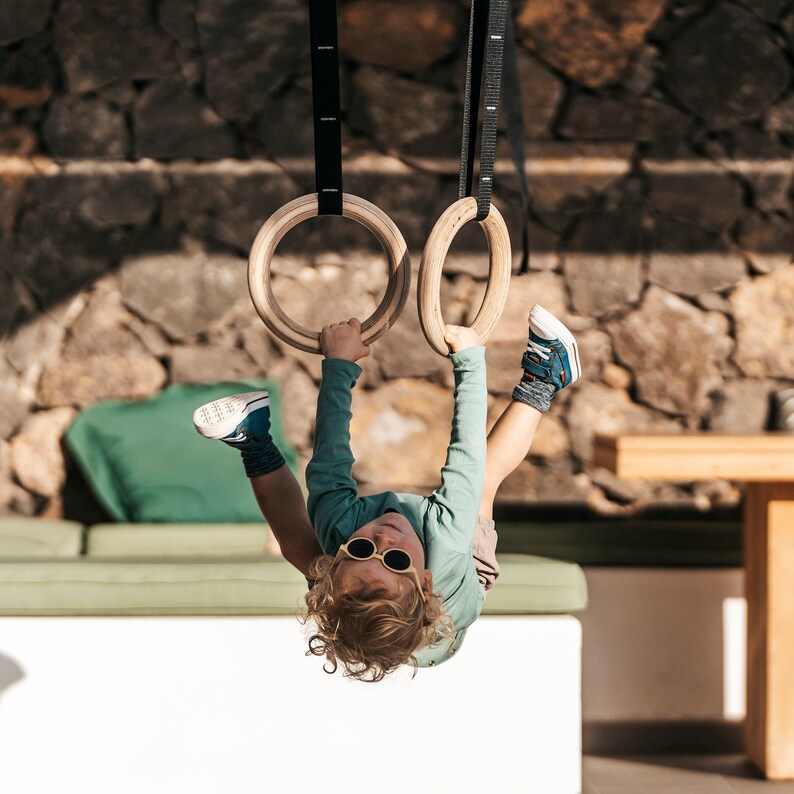 Children playing on rings