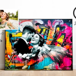 May include: A colorful graffiti-style painting of a couple in black and white, with the woman wearing a white veil. The background is a vibrant mix of pink, yellow, blue, and orange.