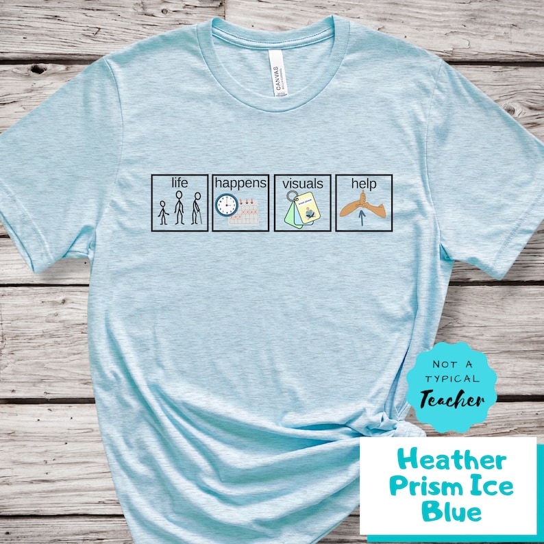 May include: Light blue t-shirt with the text "Life happens visuals help" and four icons representing each word. The shirt also has a white circle with the text "Not a typical teacher" in black text.
