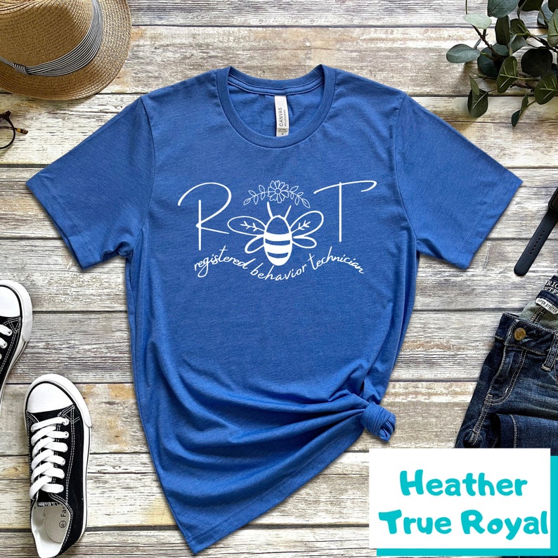 May include: A blue t-shirt with a white graphic of a bee with the text "RBT registered behavior technician".