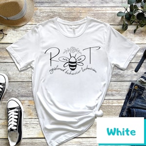 May include: White t-shirt with a black bee graphic and the text "RBT registered behavior technician".