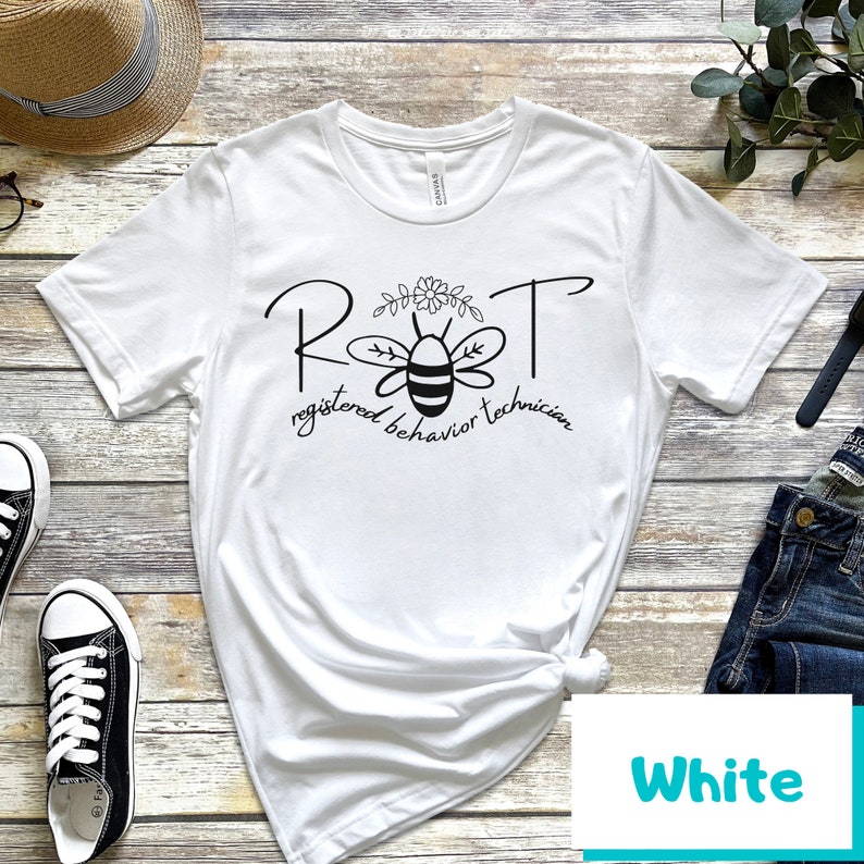 May include: White t-shirt with a black bee graphic and the text "RBT registered behavior technician".
