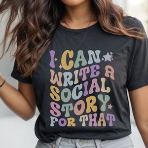 May include: Black t-shirt with a colorful graphic that says "I can write a social story for that".