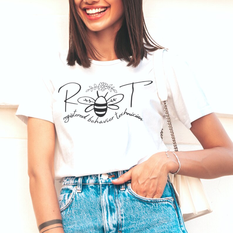 May include: White t-shirt with a black and white bee graphic and the text "RBT registered behavior technician".