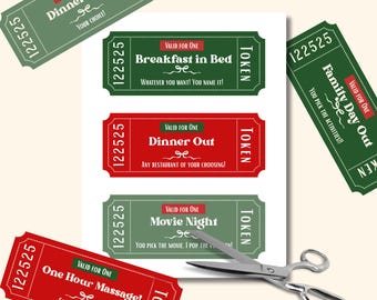 May include: Gift tokens with various experiences printed on them, including dinner, breakfast, movie night, and massage. The tokens are red and green with white text and a decorative scroll. Scissors are placed near the tokens.