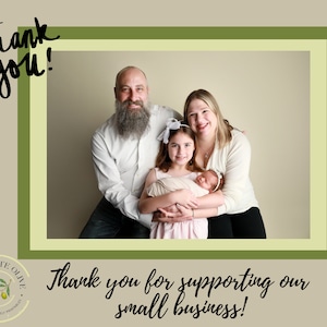 May include: A family of four poses for a photo. The parents are smiling and holding their two daughters. The older daughter is wearing a pink dress and the younger daughter is wearing a white blanket. The family is standing in front of a light brown background. The text "Thank you for supporting our small business!" is written below the photo.