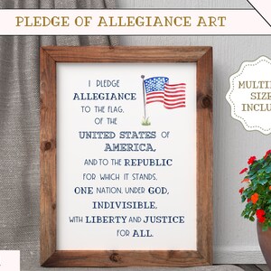 May include: A printable digital art print featuring the Pledge of Allegiance text in blue and white lettering on a white background. The text is framed by a brown wooden frame. A watercolor painting of the American flag is in the upper right corner of the print. The text reads: "I pledge allegiance to the flag, of the United States of America, and to the republic for which it stands. One nation, under God, indivisible, with liberty and justice for all."