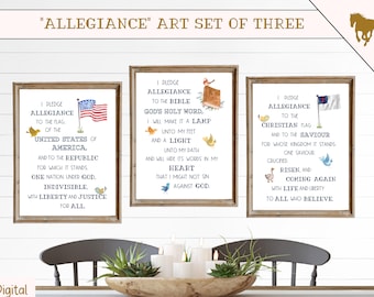 May include: Three printable wall art prints with a patriotic theme. Each print features a different pledge of allegiance: to the American flag, to the Bible, and to the Christian flag. The prints are framed in wood and have a white background with blue and red text.