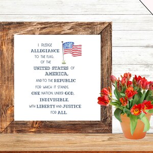 May include: A framed print with the Pledge of Allegiance text and an American flag illustration. The text reads "I pledge allegiance to the flag, of the United States of America, and to the republic for which it stands, one nation, under God, indivisible, with liberty and justice for all."