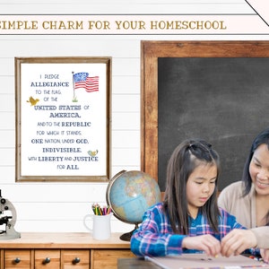 May include: A framed print with the Pledge of Allegiance to the United States of America, featuring a small American flag and birds. A girl and a woman are working on a craft project at a table with a globe, pencils, and a microscope.