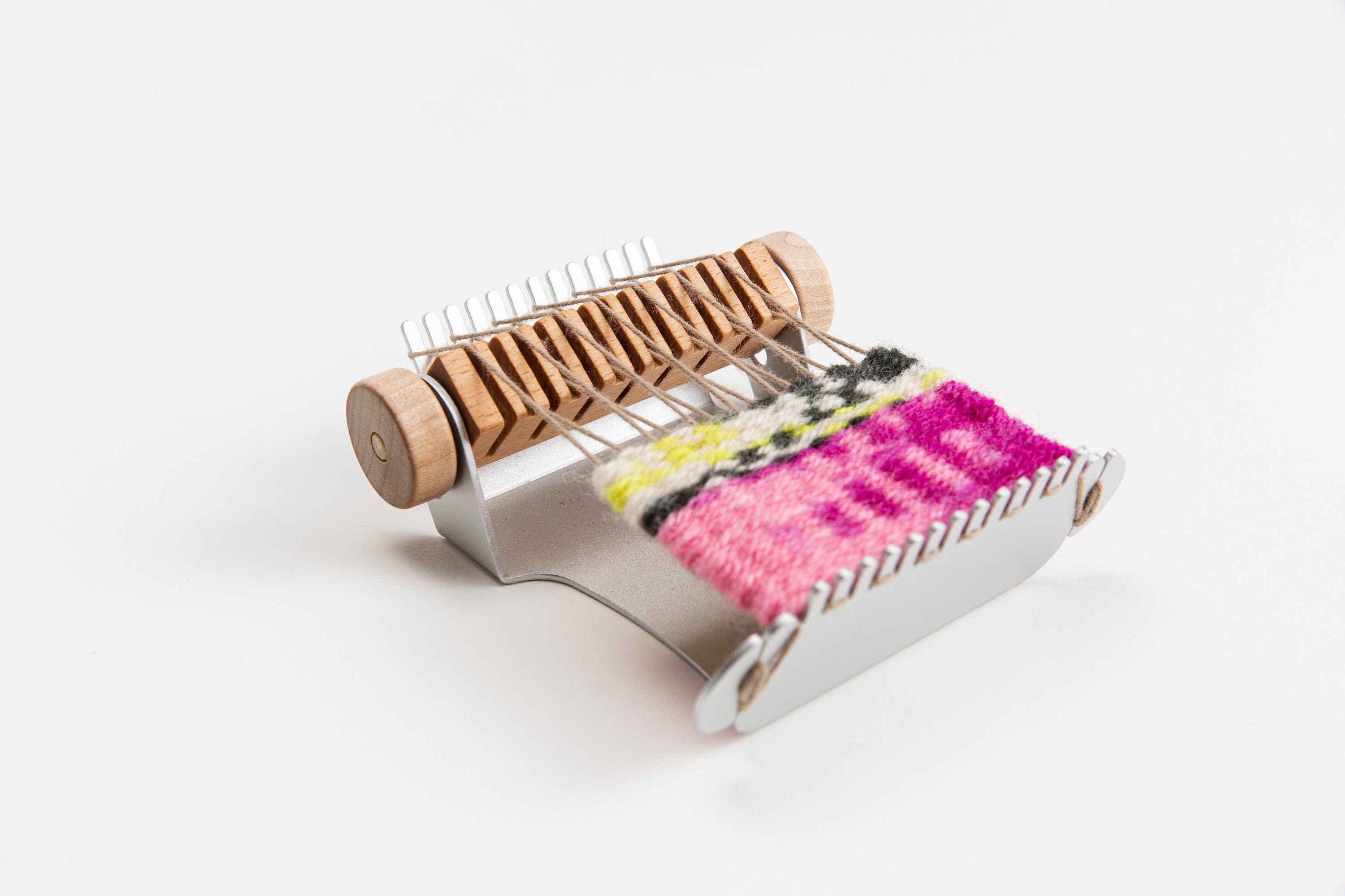 Teeny loom for easy on-the-go crafts. Be creative anywhere — boomloom