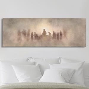 May include: A rectangular canvas print depicting a group of silhouetted figures in a hazy, sepia-toned scene. The figures are clustered around a central, illuminated area, creating a sense of mystery and depth. The artwork is mounted on a white wall above a bed.