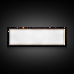 May include: A blank canvas stretched over a wooden frame, ready for painting. The frame is made of dark wood and has a black border around the canvas.