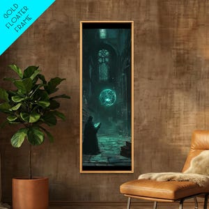 May include: A vertical rectangular wall art piece in a gold floater frame depicting a dark, stone-walled interior with a glowing teal orb floating above a figure in a dark robe holding an open book, set against a backdrop of arched windows.