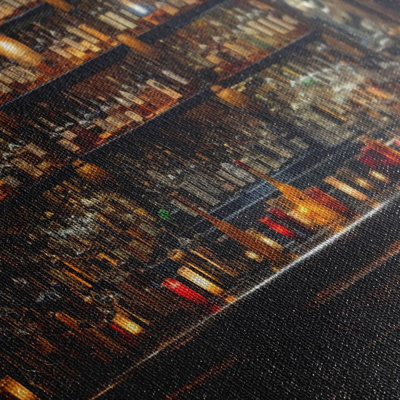 May include: A close-up of a wall of wine bottles, with the bottles arranged in rows and columns. The bottles are illuminated by a warm, golden light, creating a sense of depth and texture. The bottles are mostly red wine, but there are also some white and sparkling wines.
