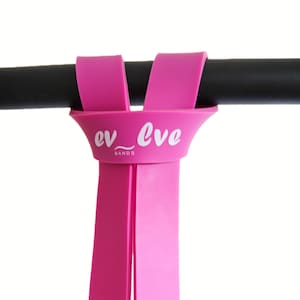 May include: Pink resistance bands looped around a black bar. The bands have the text "ev_lve BANDS" printed on them.