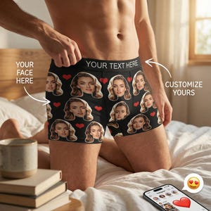 May include: Black boxer shorts featuring a repeating pattern of a woman's face and red hearts. The waistband has the text "YOUR TEXT HERE". The words "YOUR FACE HERE" and "CUSTOMIZE YOURS" are also visible.
