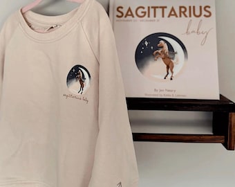 sagittarius baby book & toddler crewneck - personalized baby shower gift, baby's first birthday (12m-5t)