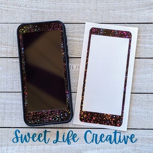 May include: Two phone cases with a black background and a colorful confetti design. The case on the left is a black phone case with a screen protector. The case on the right is a clear phone case with a white background.