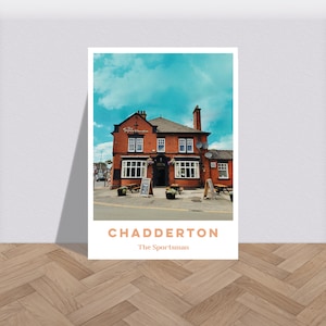 Pode incluir: Um edifício de tijolo vermelho com um céu azul ao fundo. O edifício tem uma placa que diz "The Sportsman" e está localizado em Chadderton.