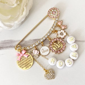 Pink customized baby pin with bead name