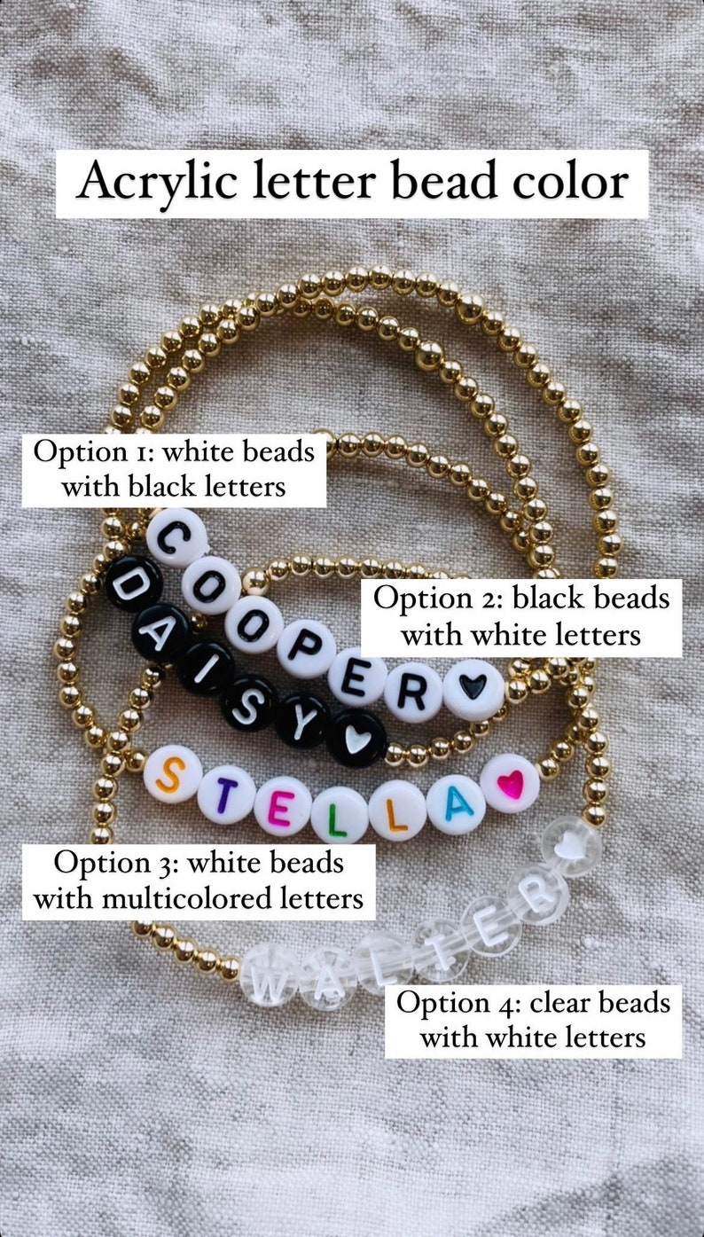 May include: Four different options for letter bead bracelets. The first option has white beads with black letters, the second has black beads with white letters, the third has white beads with multicolored letters, and the fourth has clear beads with white letters. The bracelets spell out the names "COOPER", "DAISY", "STELLA", and "WALTER".